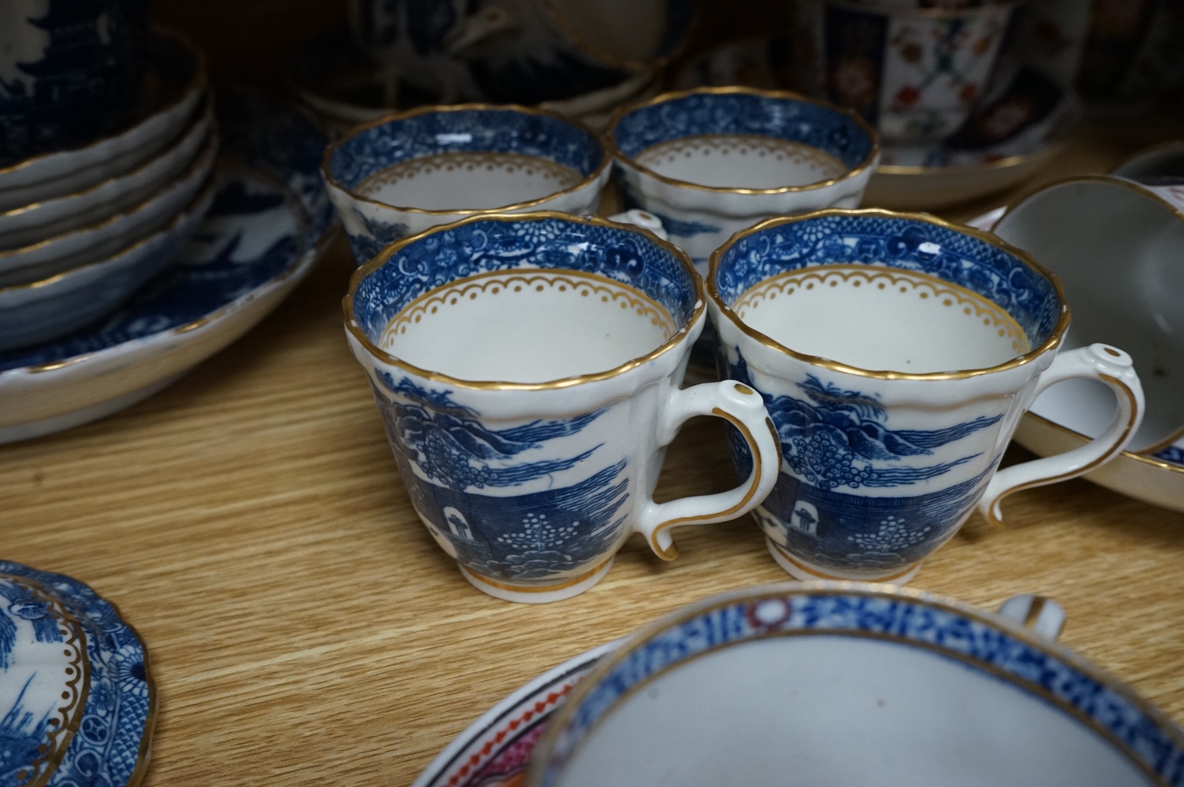 A group of late 18th century Worcester kakiemon pattern tea and coffee wares together with Worcester and Caughley Willow type pattern blue and white coffee ware